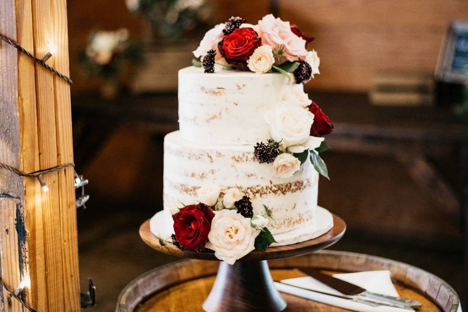 Naked wedding cake with flowers