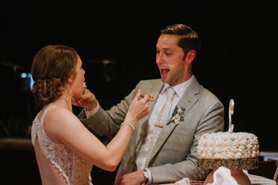 Couple feeding each other cake