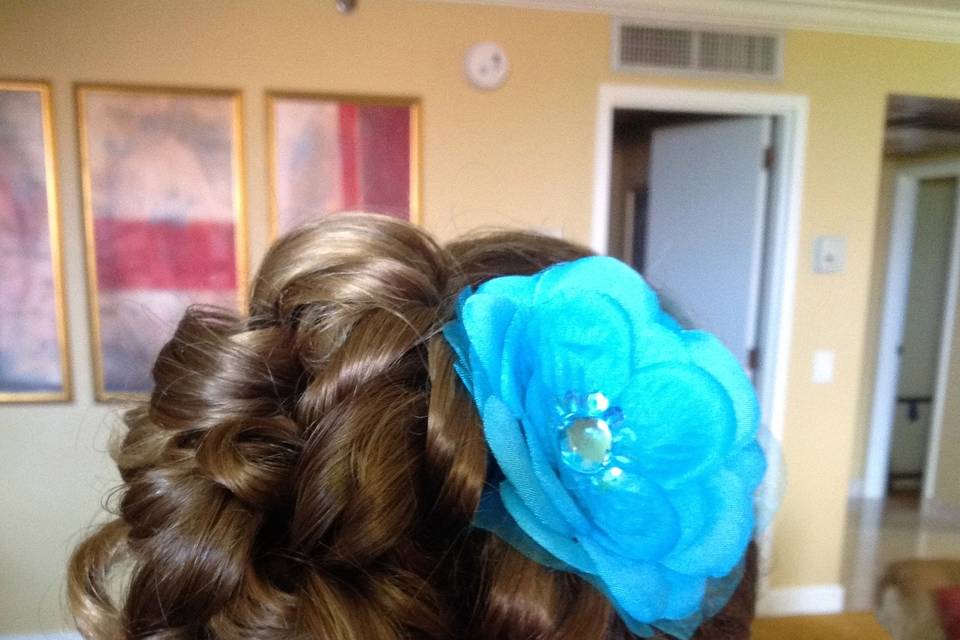 Hair up do with blue flower