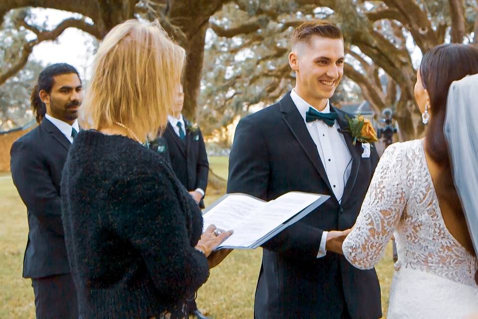 Groom smiling at his bride