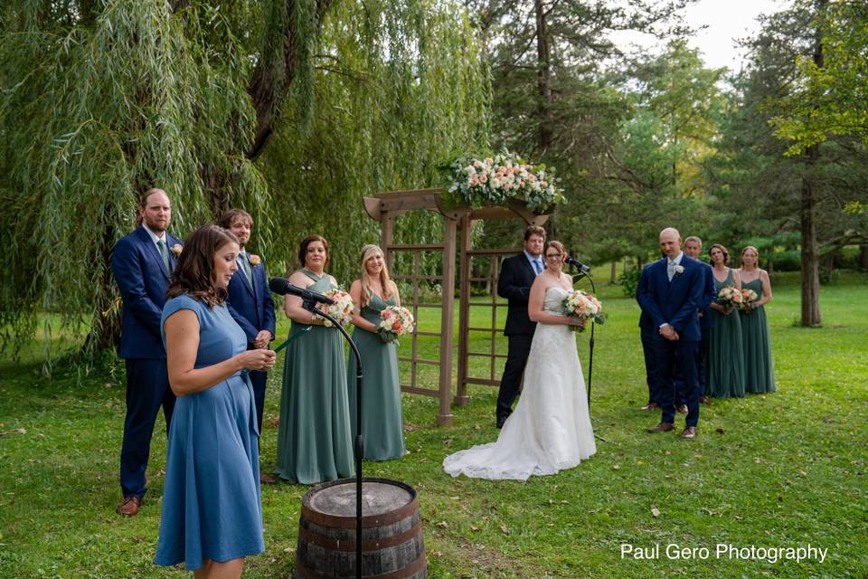 Ceremony in front of willow