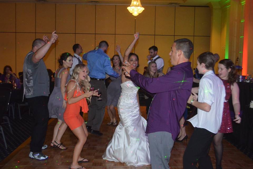 Dancing bride and guests