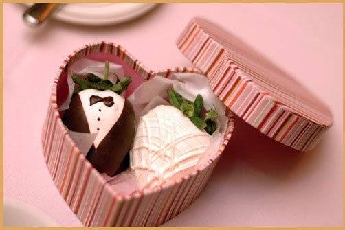 Bride & Groom strawberries in heart-shaped box.