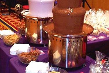 Large milk and pink chocolate fountains.