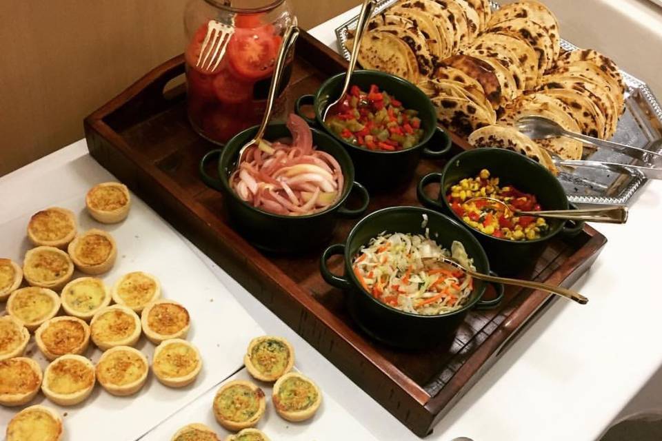 constructed quiche and mint taco station with a variety of toppings