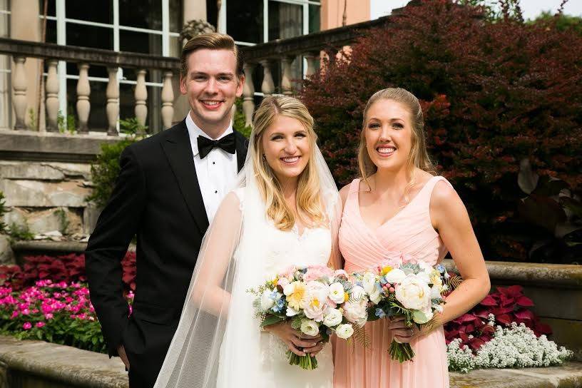 The newlyweds and a bridesmaid