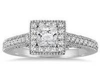 Princess cut diamond in and antique deco-style halo engagement ring. Available in white or yellow gold.