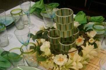 Hawaiian Elegance was the theme for this ladies luncheon. With four mosaic candle holders which illuminated the table once lit. Set leaf china and a bamboo placemat to complete the look.