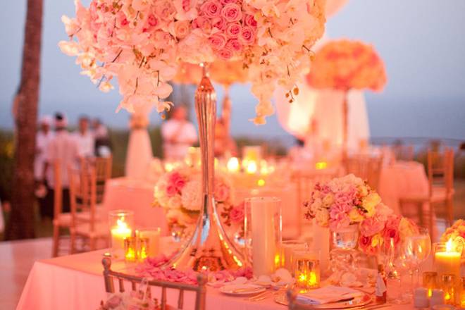 Elegant and colorful small Antique Roses add contrast and flare to this floral display. Creams, pinks and gold were the color theme for the Manor-Hunt wedding located on her parents Lake Lewisville property. With an open tent in the same color story providing cover, while allowing the beauty of the surroundings to show.