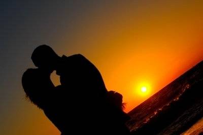 Newlyweds pouring the sand