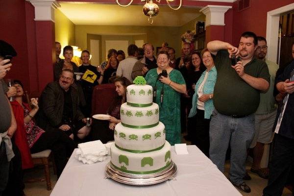 This was a Space Invaders-themed wedding cake for two self-proclaimed geeks. The cake topper was made by hand, it was the 