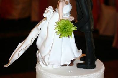Custom hand made clay bride and groom toppers.