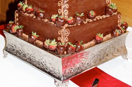 Dark chocolate ganache, fresh strawberries, and chocolate cake.