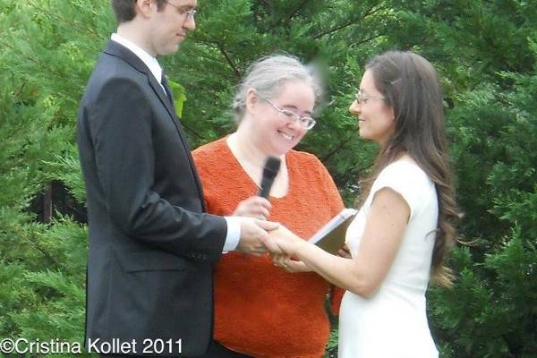 The officiant in black and white