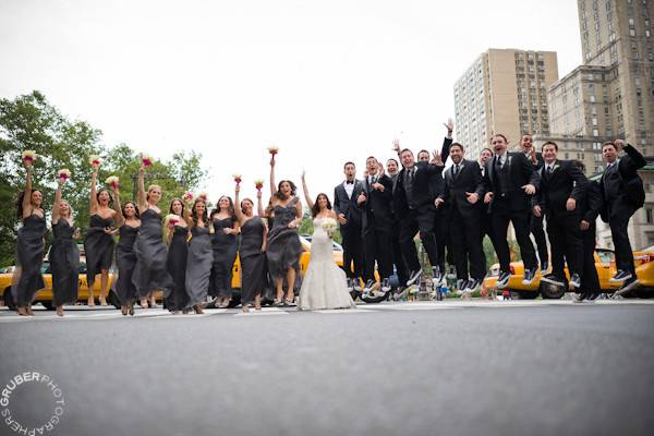 Wide shot of the wedding party. Not everyone can jump but they all still look amazing while trying.