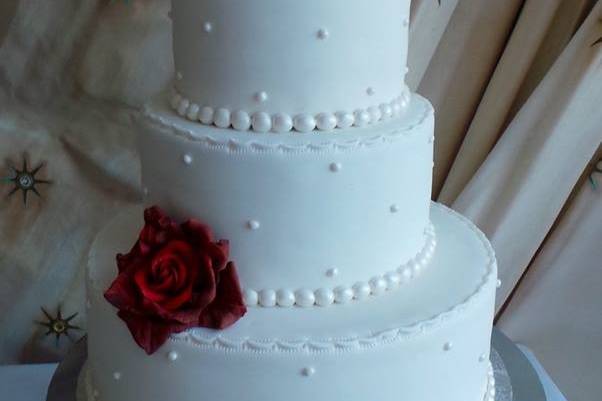 Wedding cake with bride and groom topper