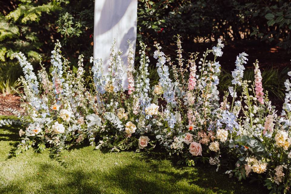 Grounded floral arch