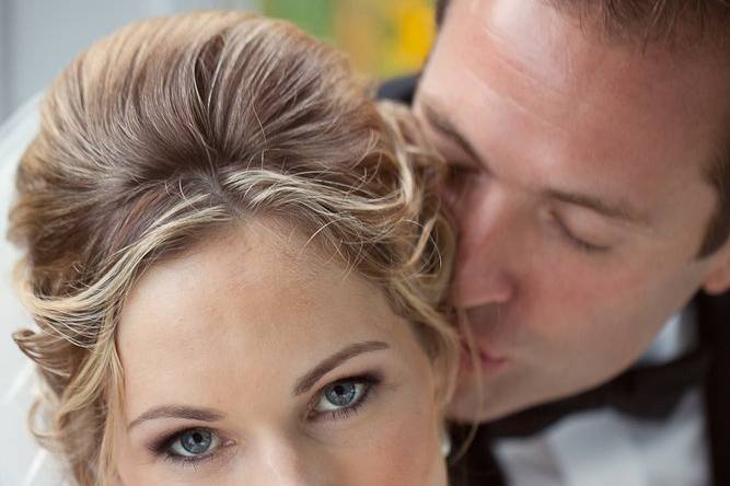 Groom hugging the bride