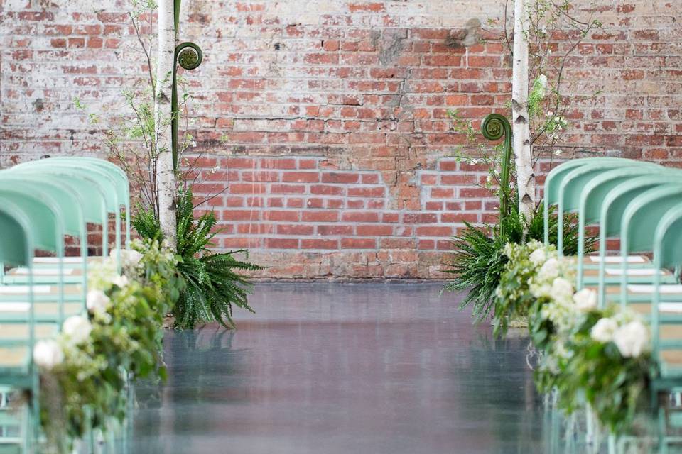 customized wedding arch with birch air plant, succulent, giant fiddle fern head at The Green Building