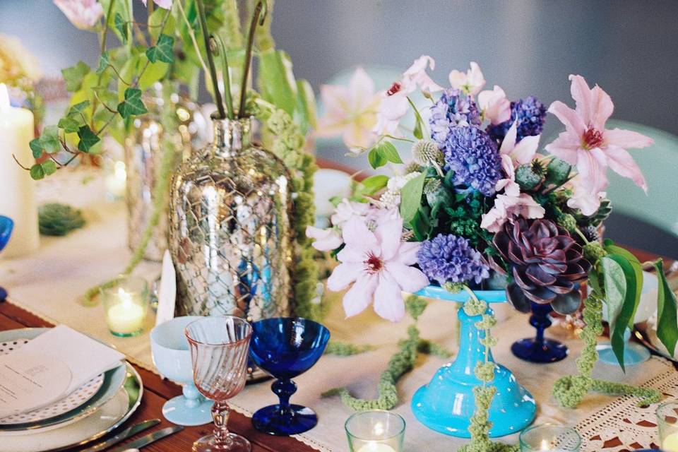 Beautiful wedding table , with customized hand blown glass chandelier, clematis, hyacinth, succulent