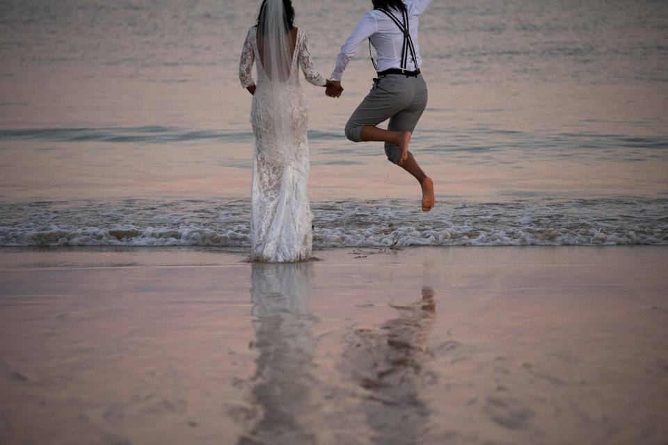 Couple wading into water