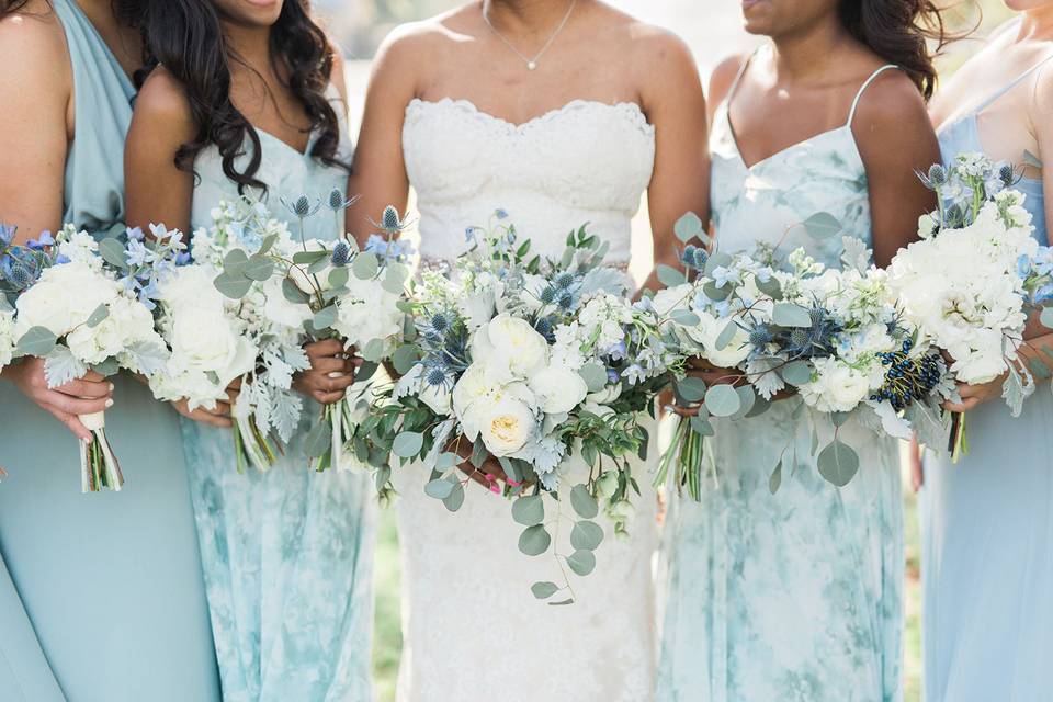 Blue bridesmaids with bouquets