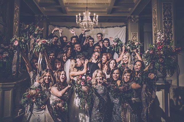 The couple with the bridesmaids and groomsmen