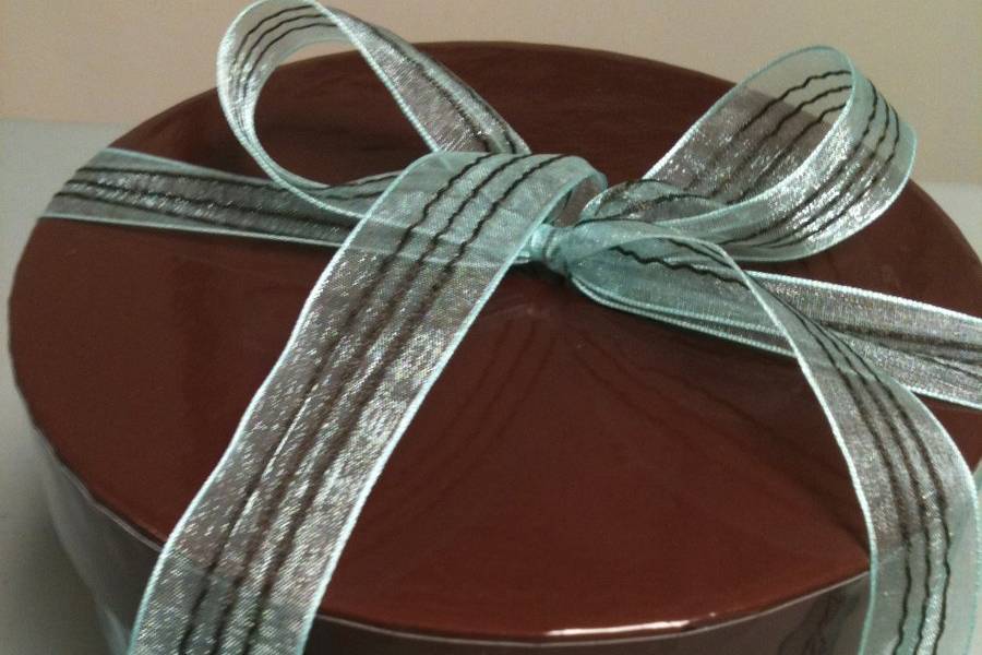 Small gift box of assorted pizzelle cookies in various pack sizes.