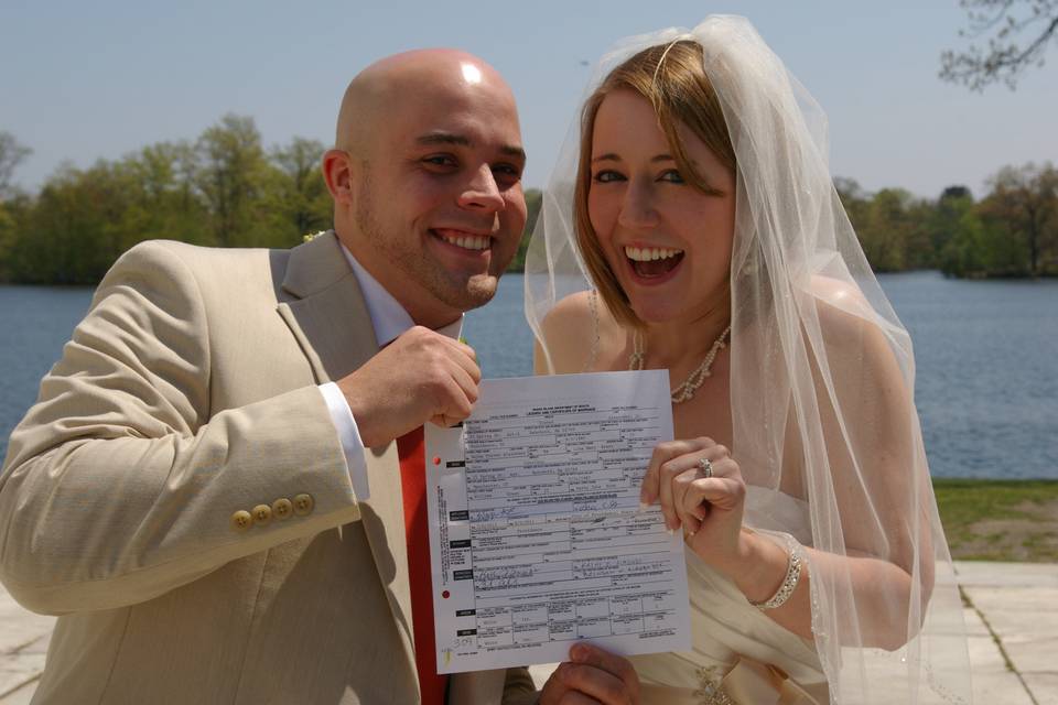 Showing off their marriage certificate