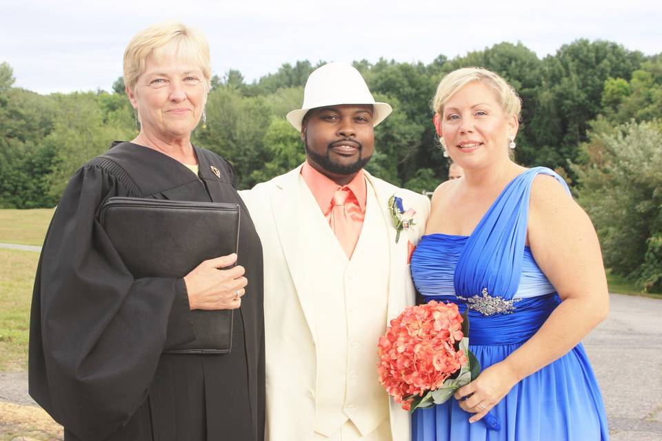 Newlyweds with the officiant