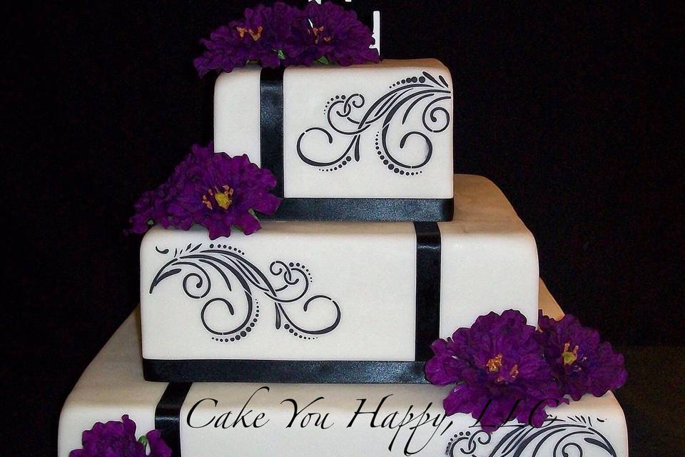 Square cake with black ribbon bands