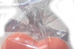 2 3d Hearts in a cellophane bag. Great for party favors. Available in milk or dark chocolate as well.