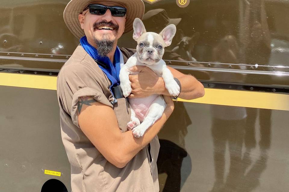 Our UPS man and our store pup