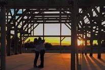 Bloomfield Barn's owners chose a gorgeous sunset under the open frame of the then-under-construction Barn as the setting for their own wedding.  You, too, can enjoy stunning photos from your big day when you choose to celebrate at the Bloomfield Barn, just outside of Chrisman, IL.