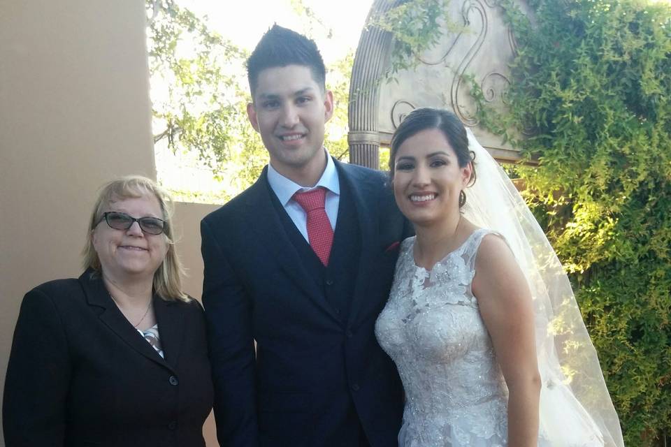 Newlyweds with the officiant