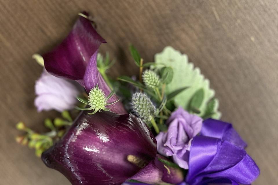 Purple callas corsage