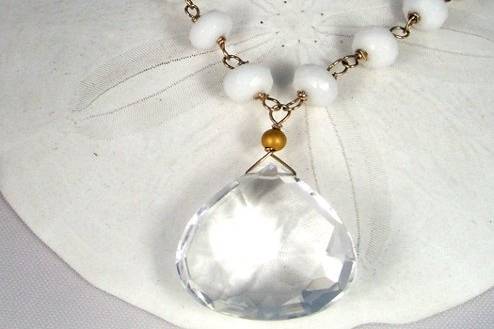 Large crystal briolette hand-wire wrapped with white agate.  Adjustable length.