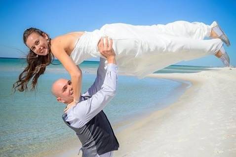 Groom lifting his bride