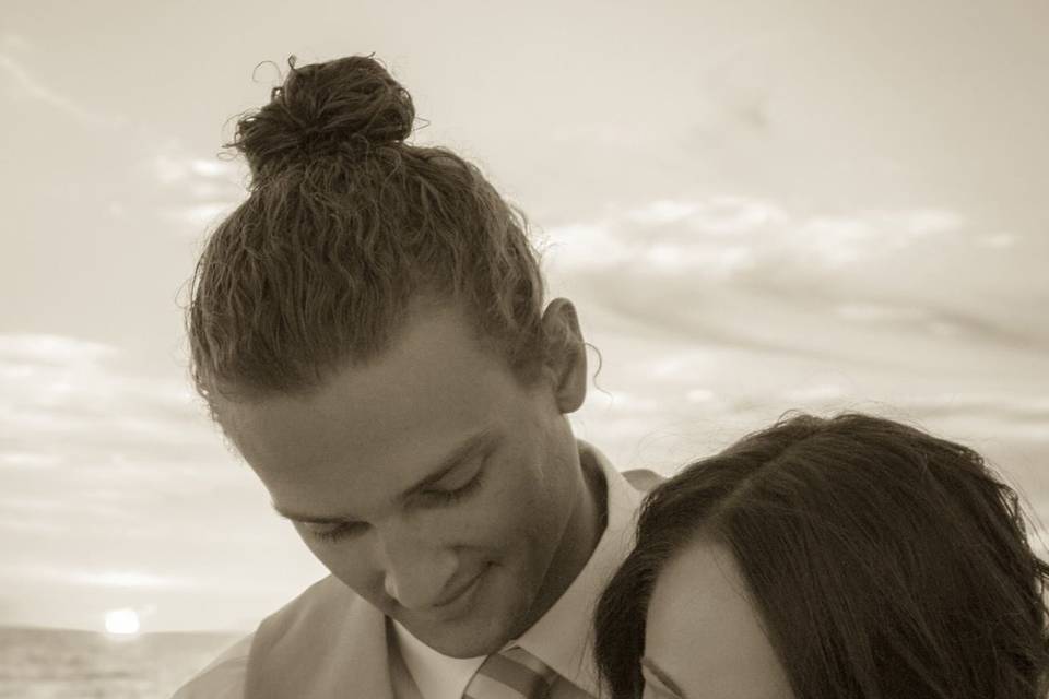 Groom embracing his bride