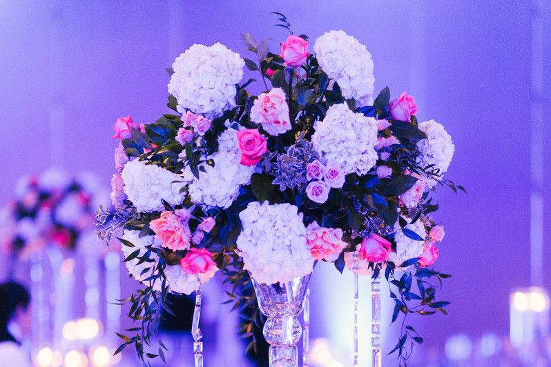 Table setup with centerpiece in violet lights