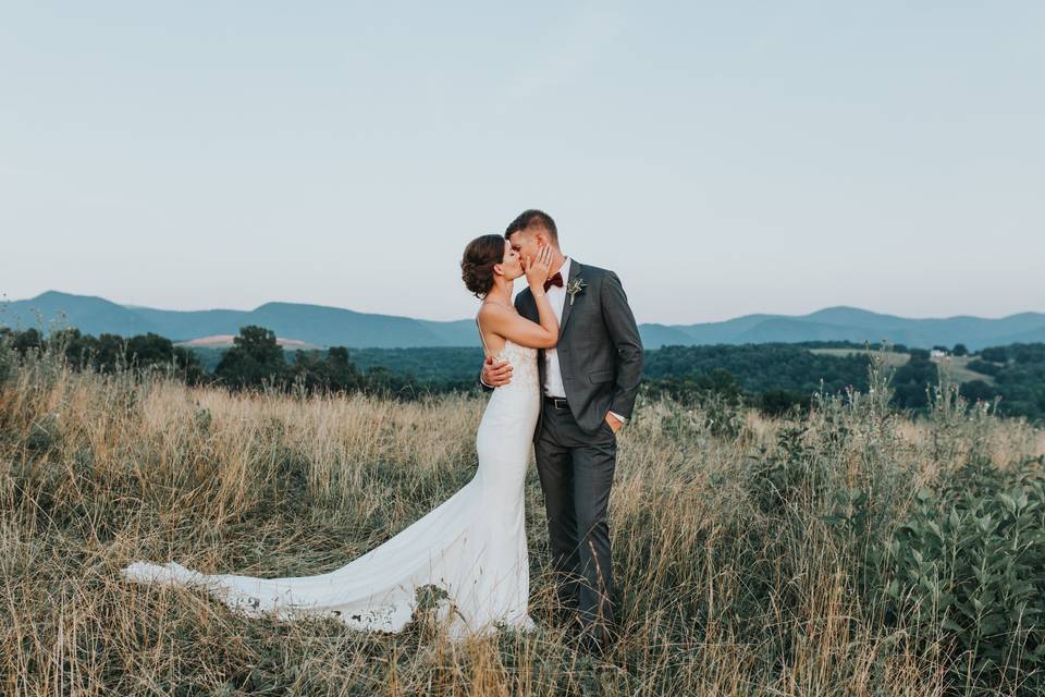 Loving couple on lone tree hill