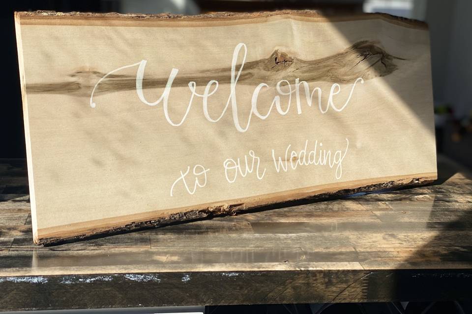 Natural wood welcome sign