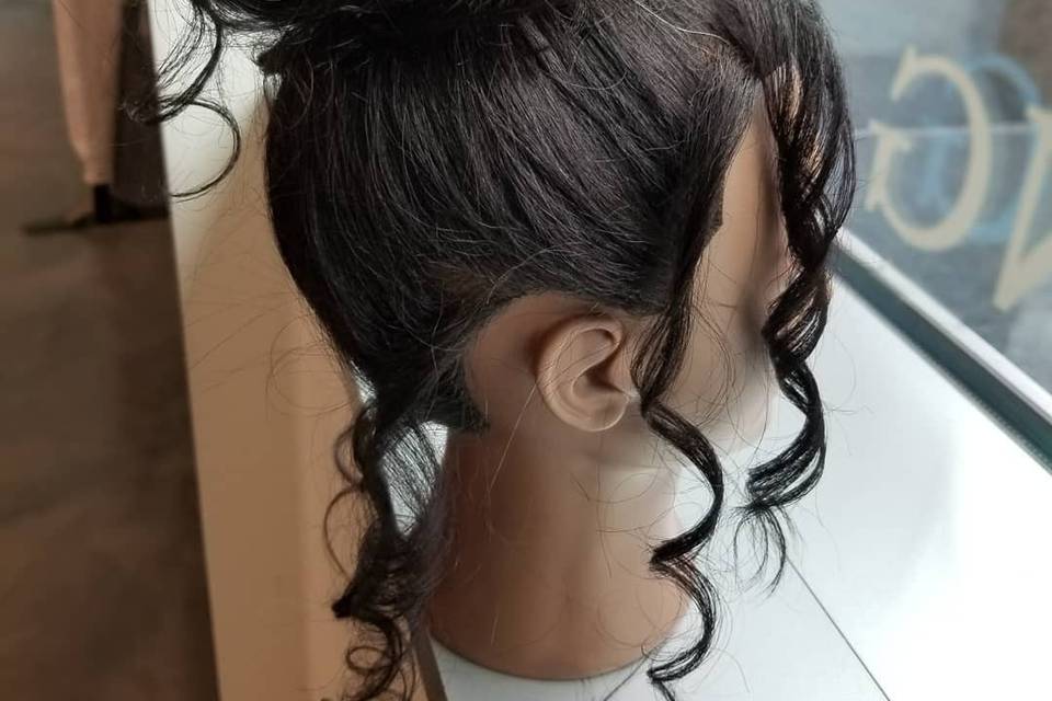 An elegant bun and loose curls