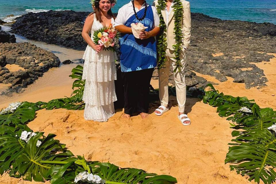 Officiant with happy couple