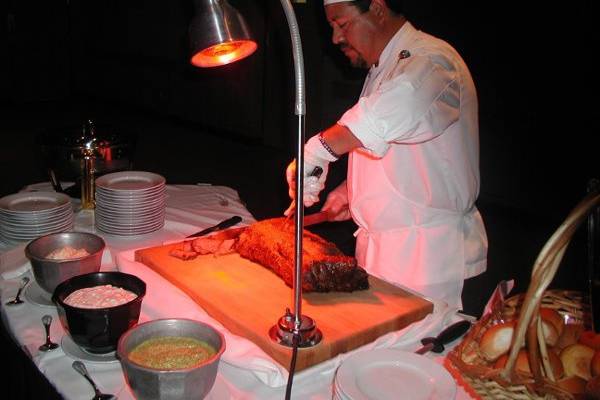 Carving station manned by professional chef.