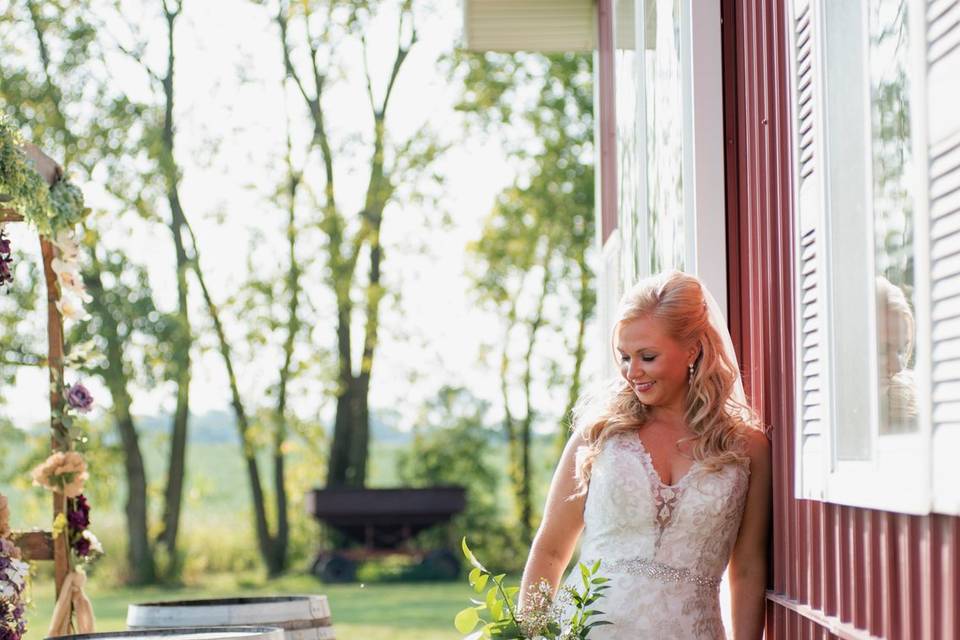 Bride by barn