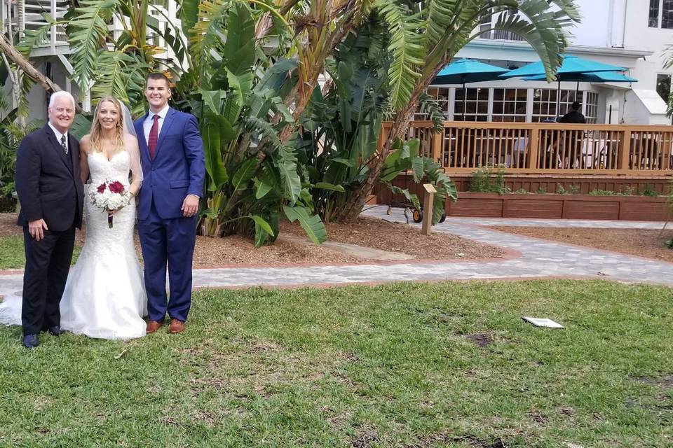 Bride and groom with their officiant