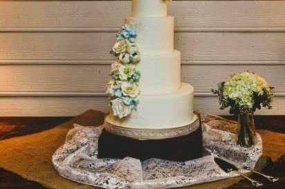 Fondant wedding cake with sugar flower cascade and lace applique