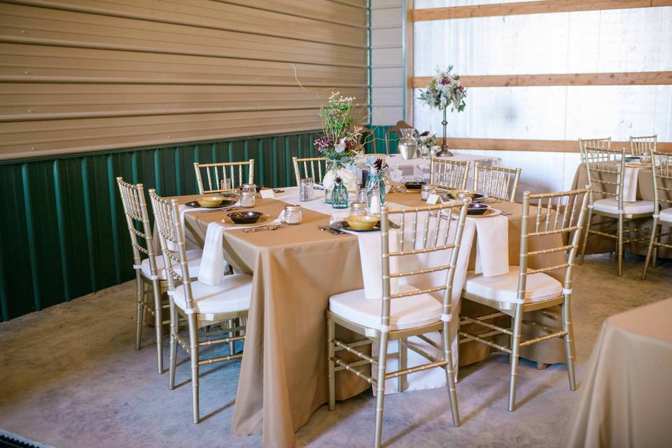 Barn Wedding, New Bloomfield, MO, Fall 2014. Burlap brown tablecloths, Designer Burlap runners in Ivory, Gold Chiavari Chairs.Rental items from Lake Party Rentals, Lake of the Ozarks, MO.