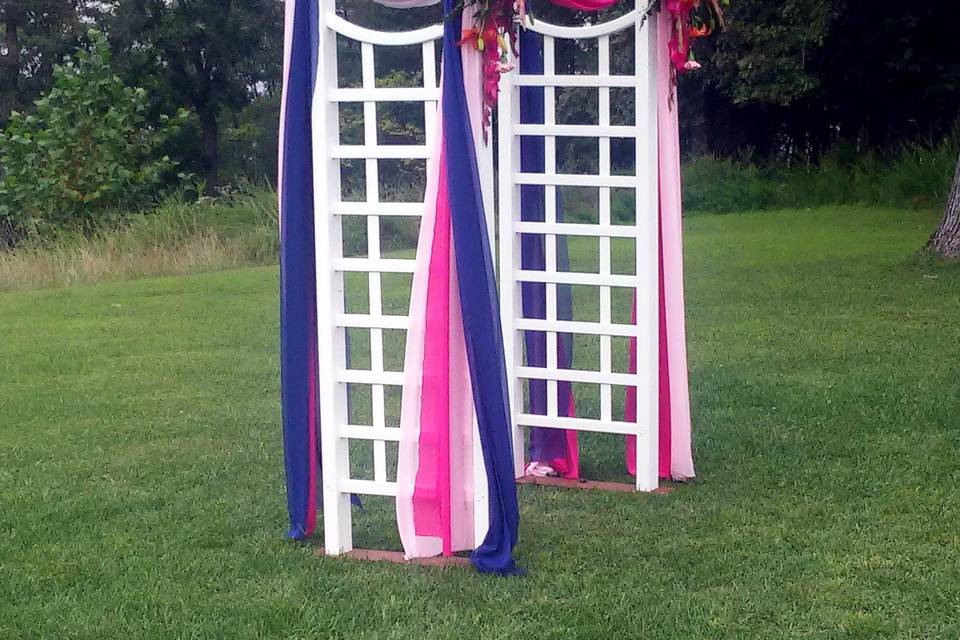 White Arbor at outdoor wedding